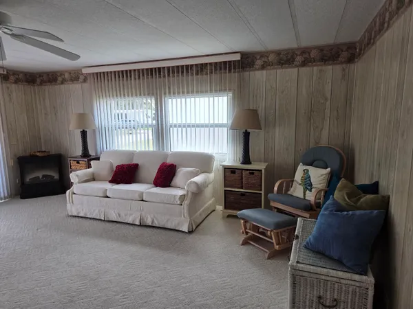 a living room with furniture and a window