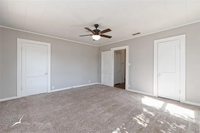 a view of a ceiling fan in a room