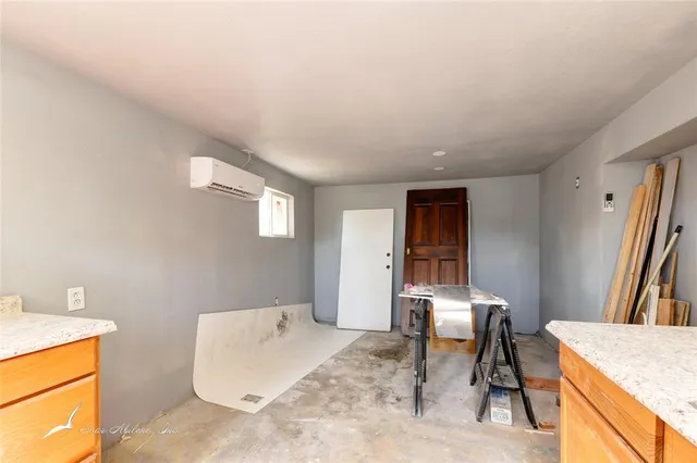 a workspace with furniture and window