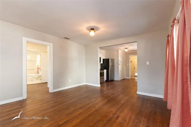 a view of a livingroom with wooden floor