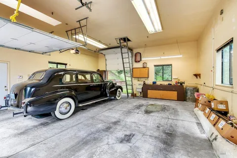 a kitchen with stainless steel appliances granite countertop sink stove and refrigerator