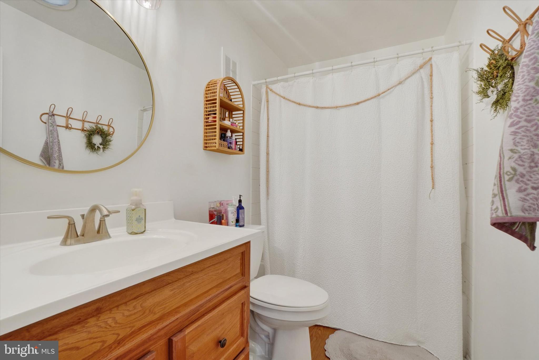 685 Colony Drive York, PA 17404 - Photo 16 of 26 a bathroom with a sink mirror vanity and toilet