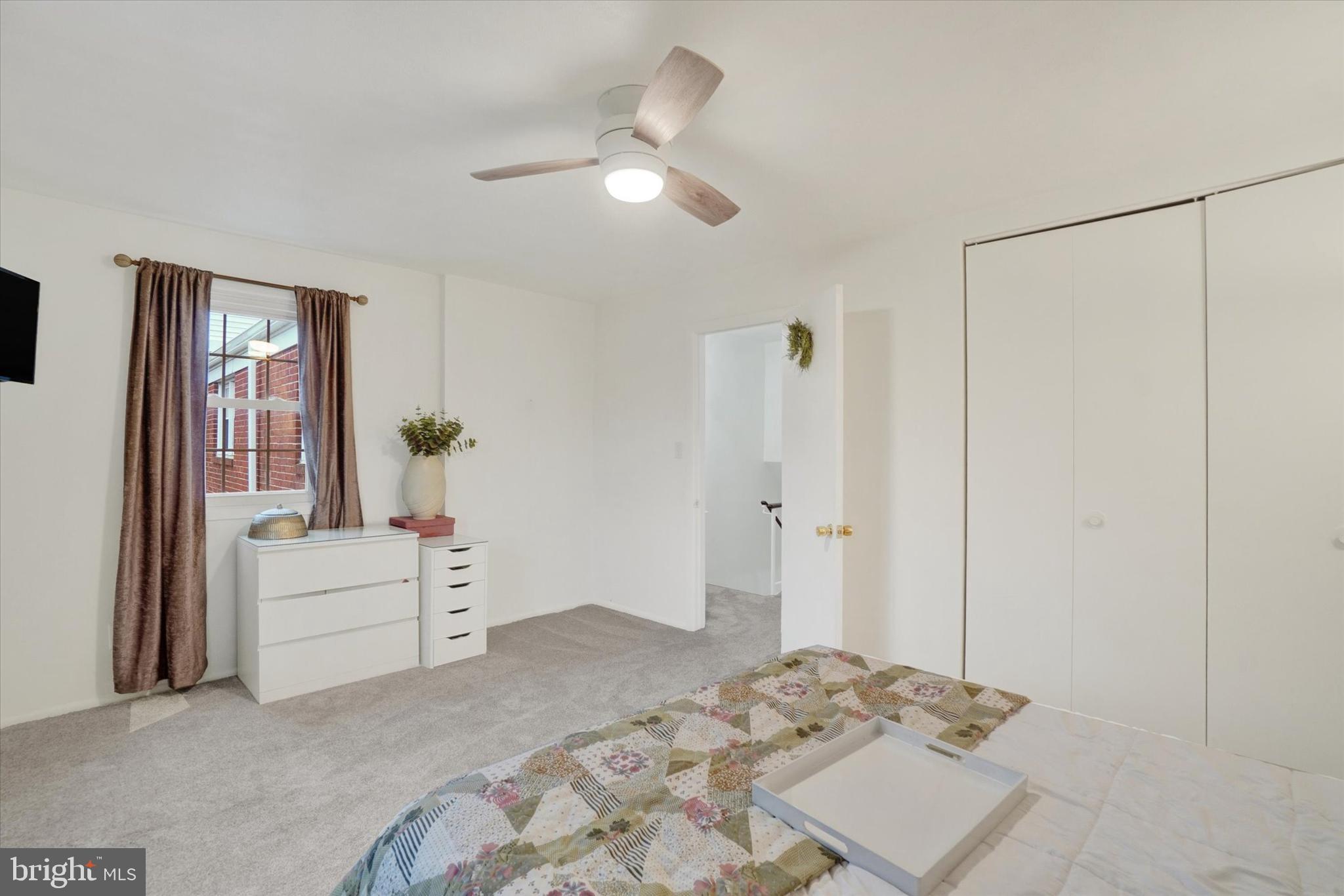 685 Colony Drive York, PA 17404 - Photo 17 of 26 a bedroom with a bed and a chandelier