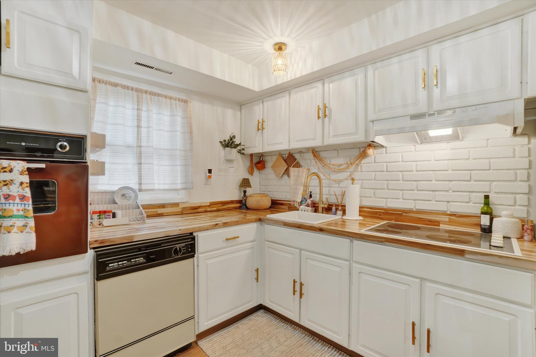 685 Colony Drive York, PA 17404 - Photo 19 of 26 a kitchen with a sink dishwasher window and cabinets