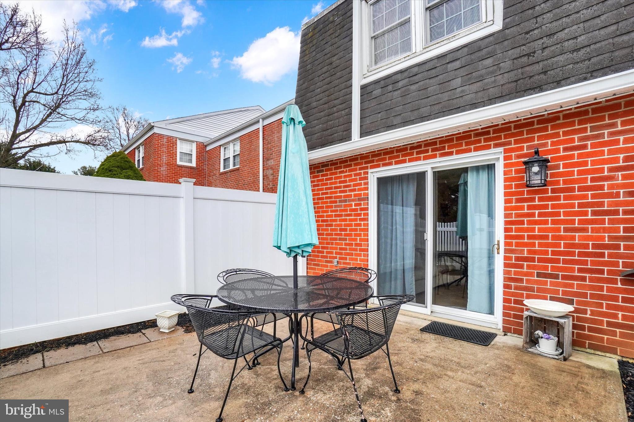 685 Colony Drive York, PA 17404 - Photo 22 of 26 a backyard of a house with table and chairs