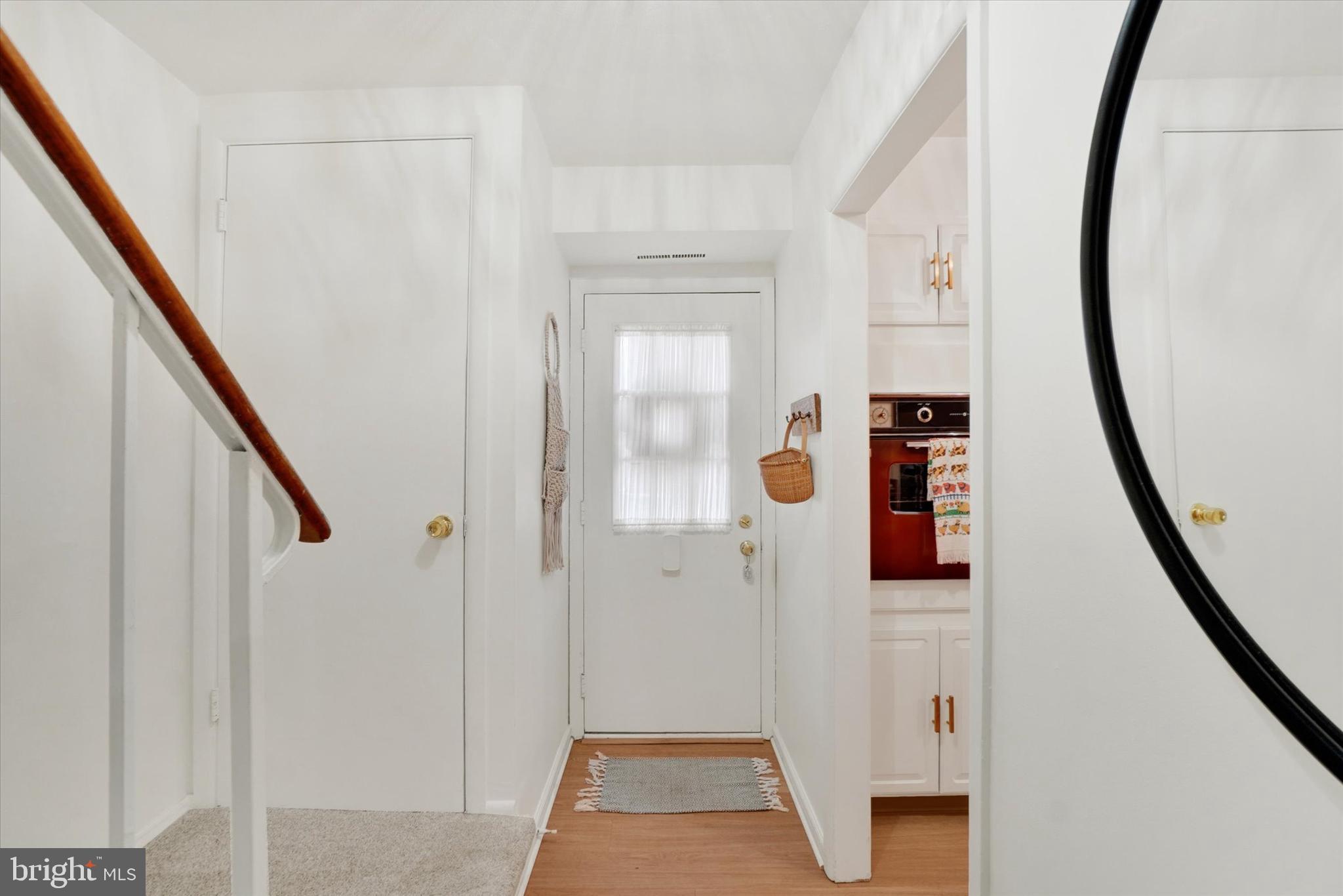 685 Colony Drive York, PA 17404 - Photo 4 of 26 a view of hallway with stairs and wooden floor