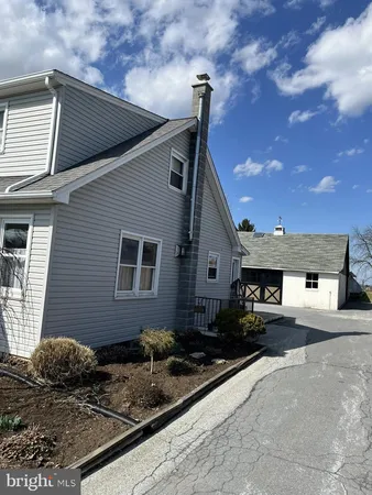 a front view of a house with yard