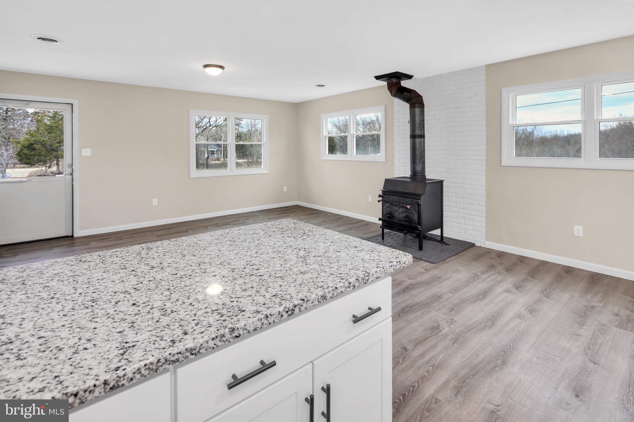 3406 Howellsville Road Front Royal, VA 22630 - Photo 12 of 29 Laminate (Vinyl plank) flooring, wood stove