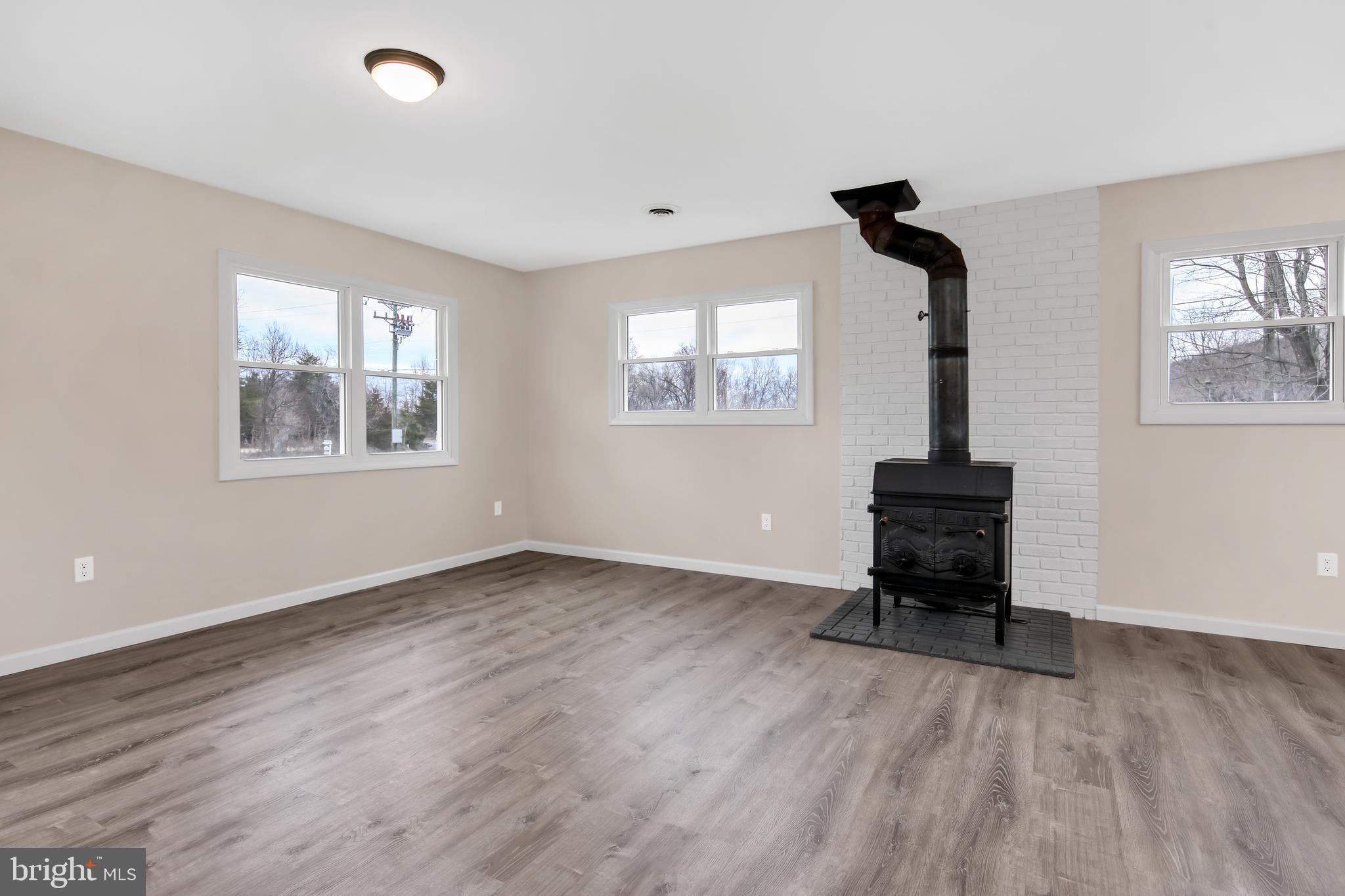 3406 Howellsville Road Front Royal, VA 22630 - Photo 14 of 29 Laminate (Vinyl plank) flooring, wood stove