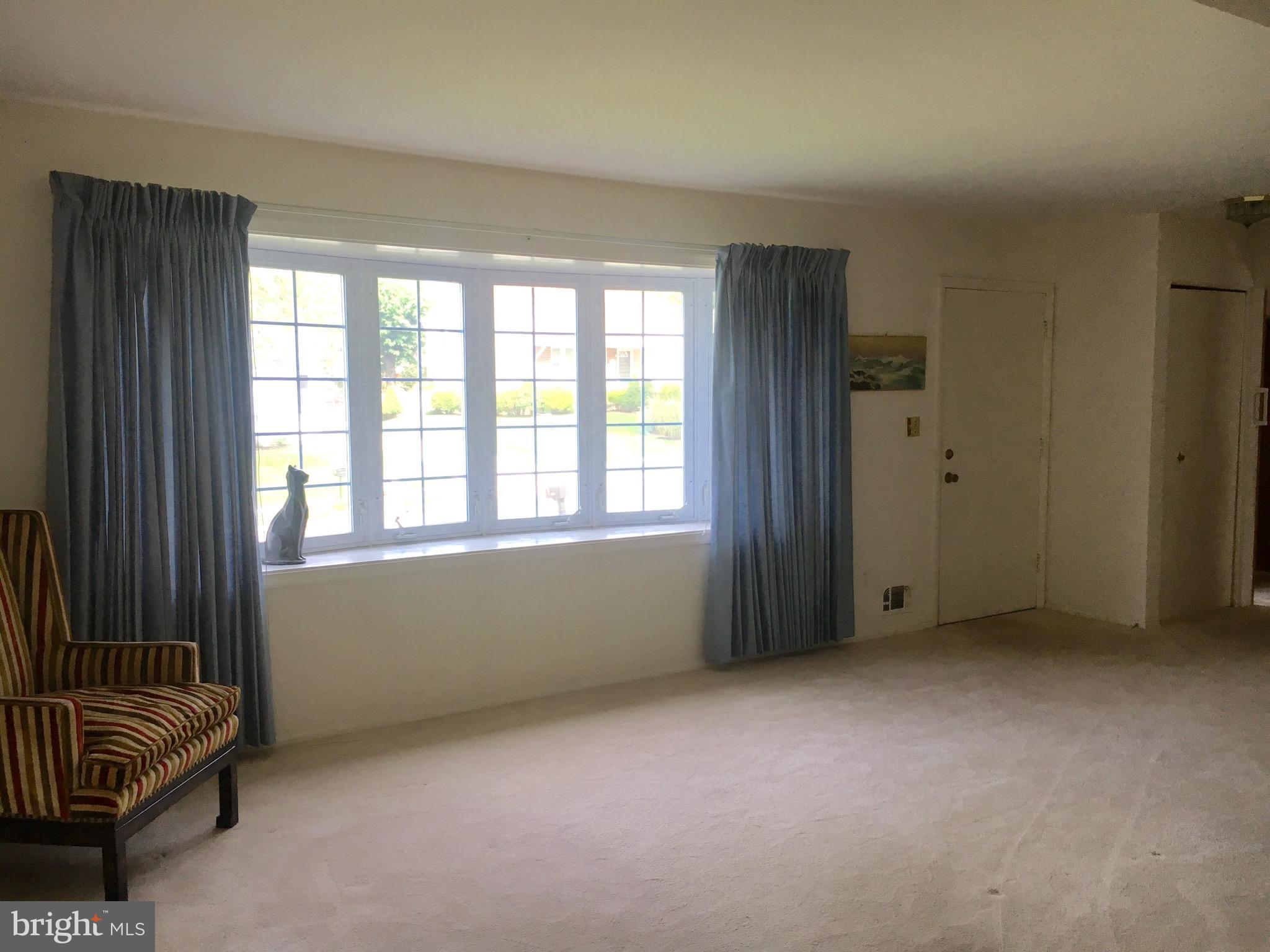 9003 Tammy Road Baltimore, MD 21236 - Photo 2 of 12 an empty room with windows