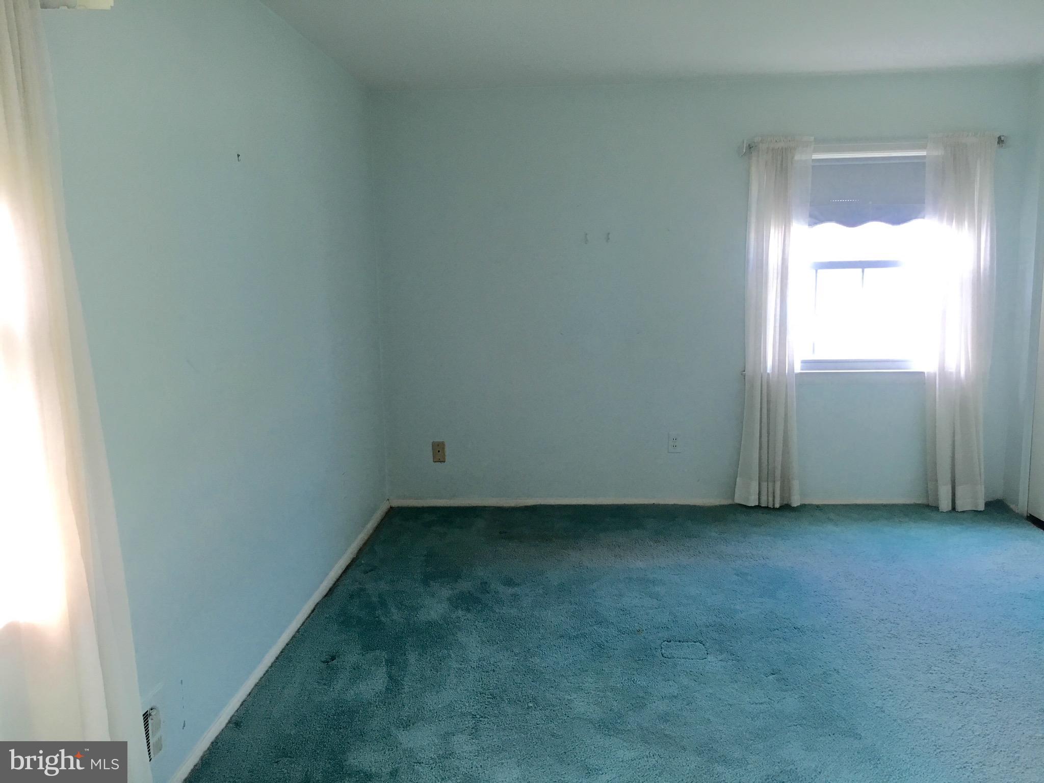 9003 Tammy Road Baltimore, MD 21236 - Photo 11 of 12 a view of an empty room and a window