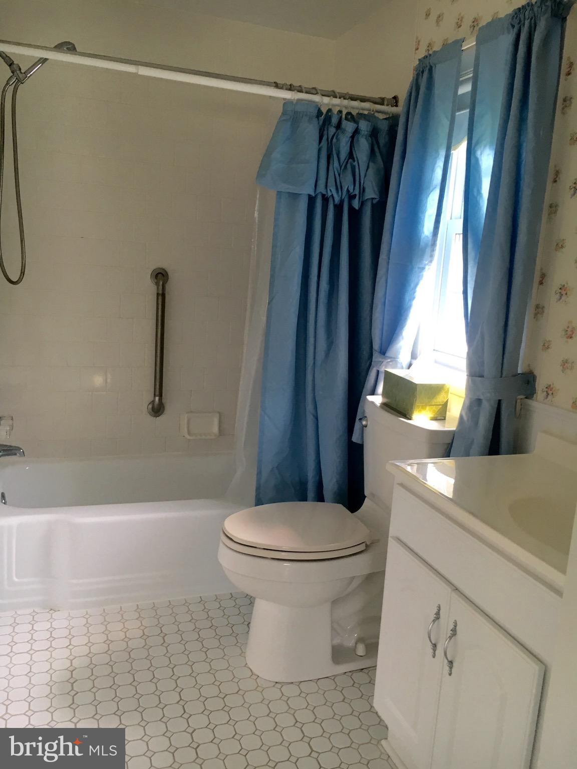 9003 Tammy Road Baltimore, MD 21236 - Photo 12 of 12 a bathroom with a sink a toilet and shower