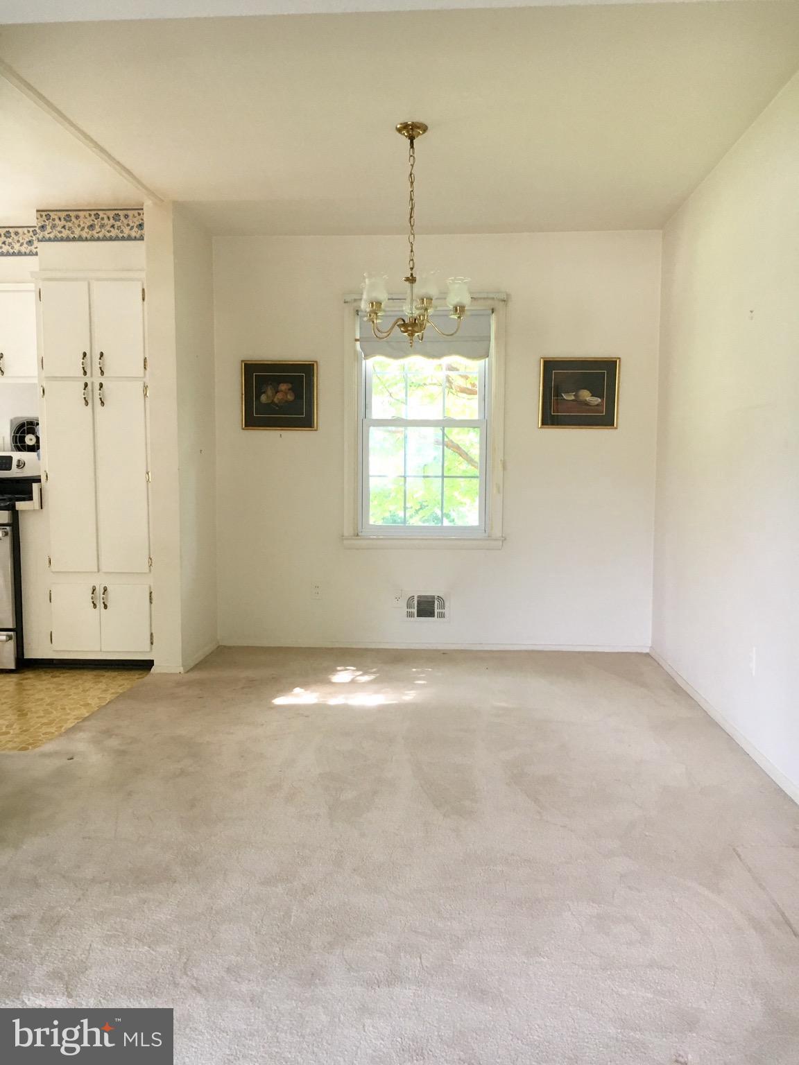 9003 Tammy Road Baltimore, MD 21236 - Photo 4 of 12 a view of a room with window and wooden floor