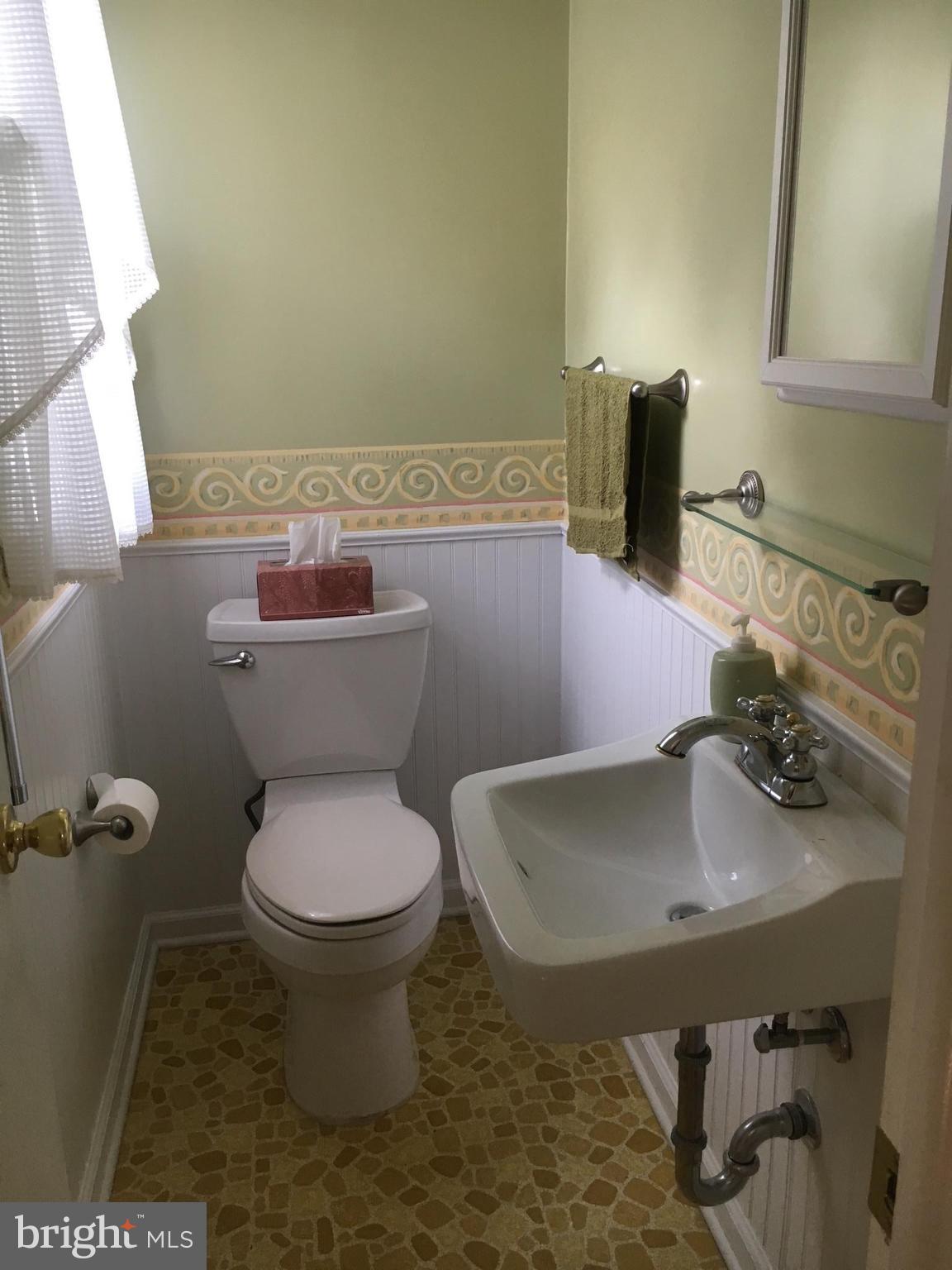 9003 Tammy Road Baltimore, MD 21236 - Photo 7 of 12 a bathroom with a sink and a toilet