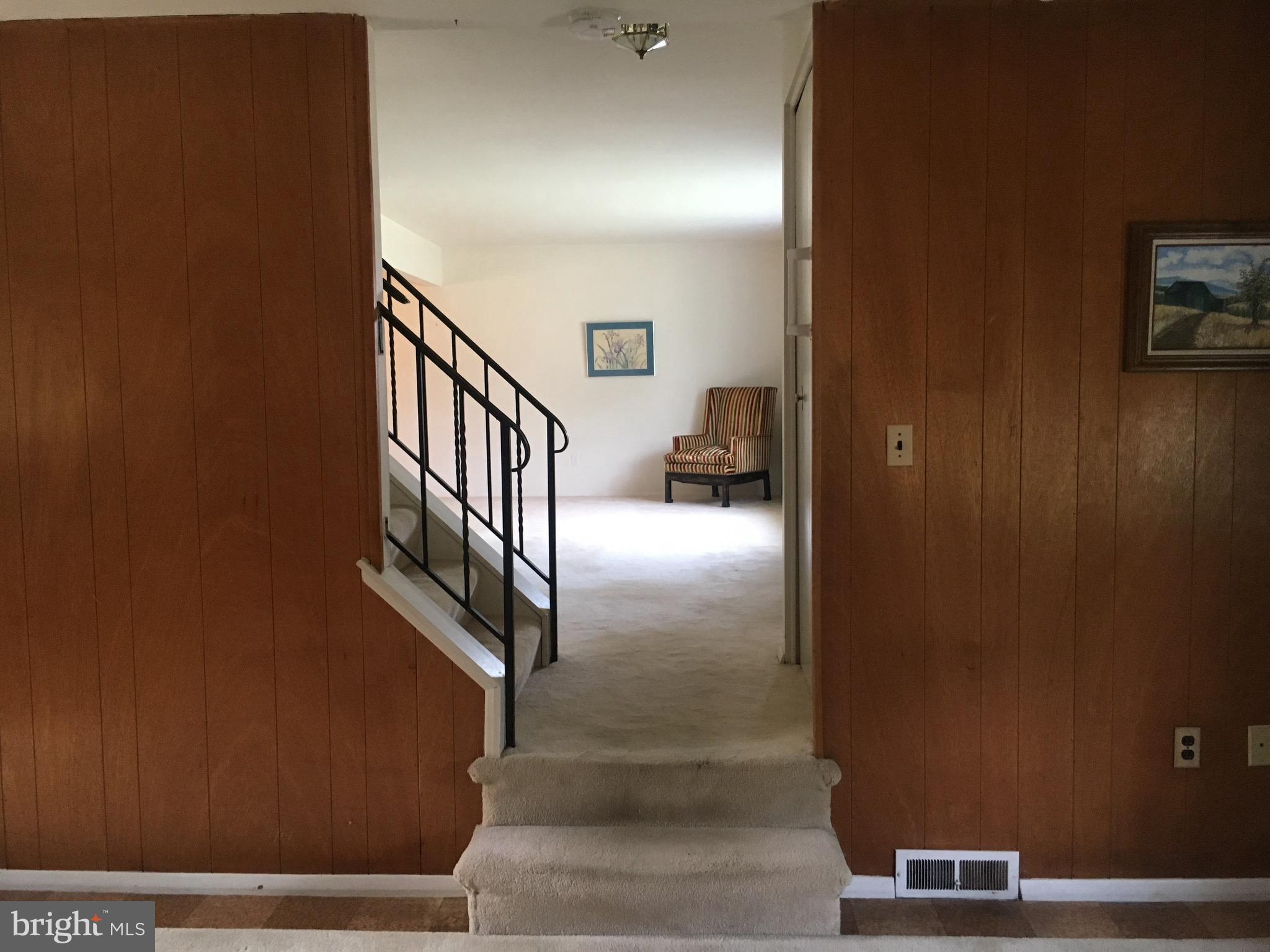 9003 Tammy Road Baltimore, MD 21236 - Photo 8 of 12 a view of staircase with a rug