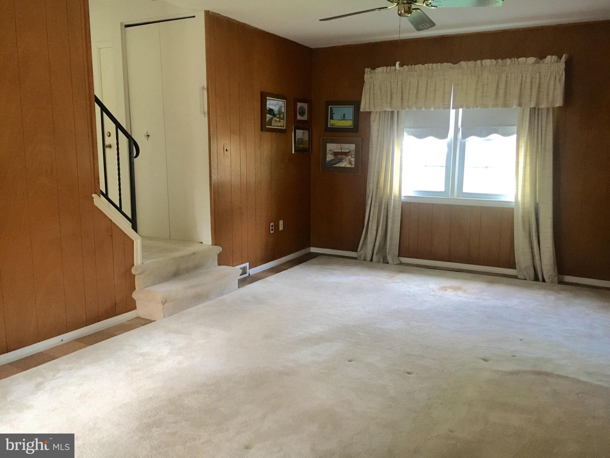 9003 Tammy Road Baltimore, MD 21236 - Photo 9 of 12 an empty room with windows