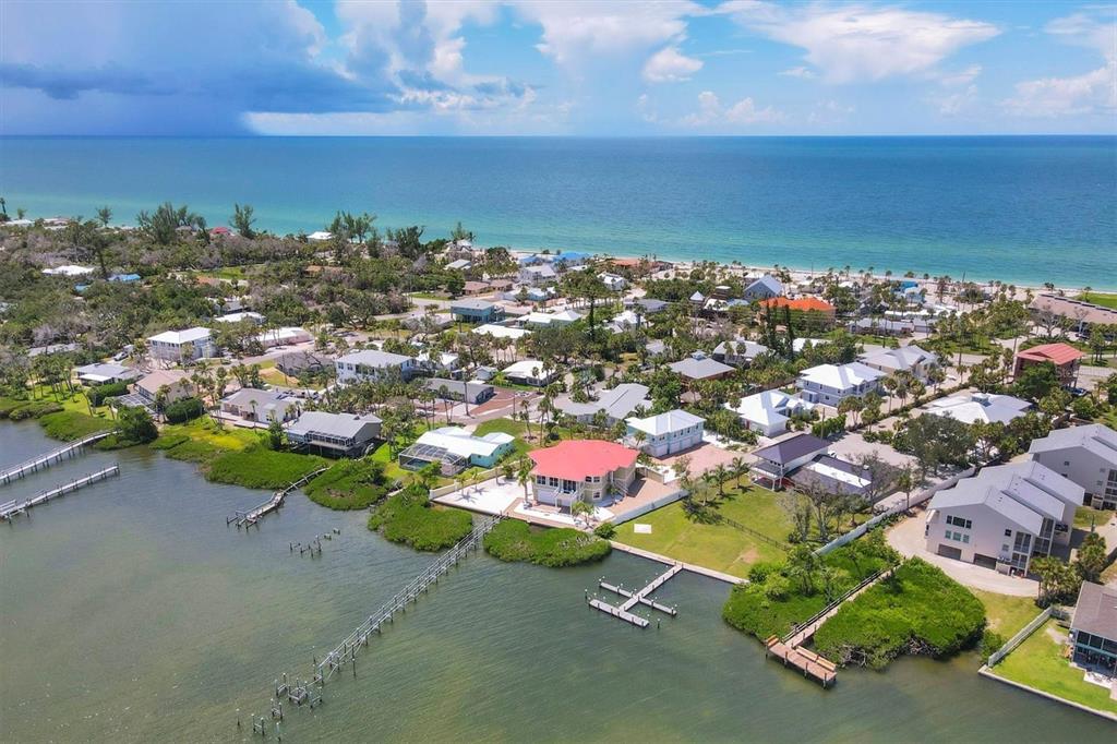4111 North Beach Road Englewood, FL 34223 - Photo 12 of 87 an aerial view of a houses with a yard