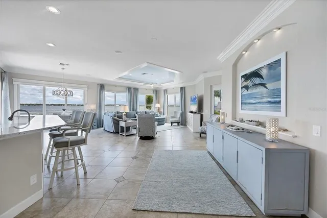 a view of a dining room with furniture and a potted plant