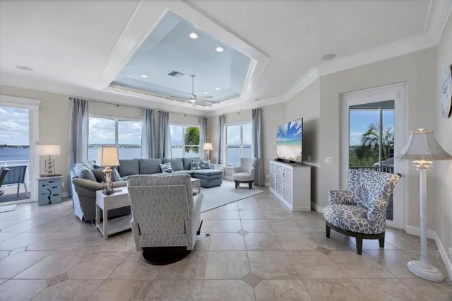a kitchen with granite countertop a sink stainless steel appliances and window