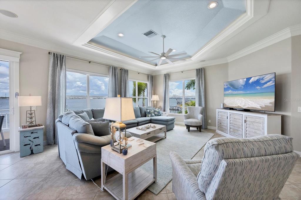 4111 North Beach Road Englewood, FL 34223 - Photo 18 of 87 a living room with furniture and a flat screen tv