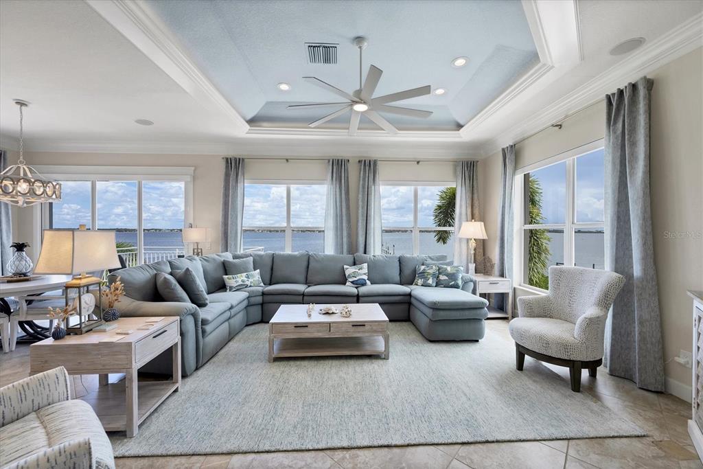 4111 North Beach Road Englewood, FL 34223 - Photo 20 of 87 a living room with furniture and a large window