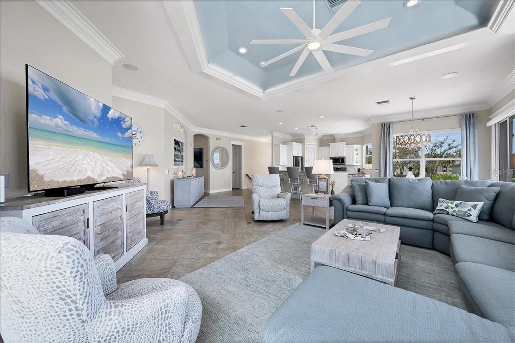 4111 North Beach Road Englewood, FL 34223 - Photo 21 of 87 a living room with furniture and a flat screen tv