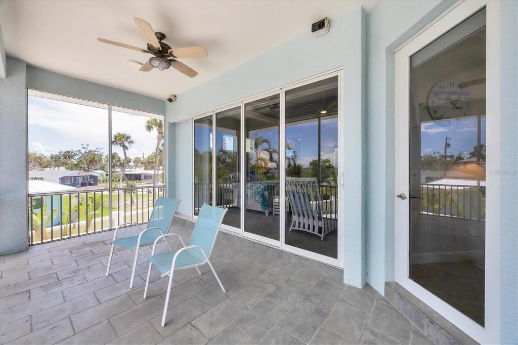 4111 North Beach Road Englewood, FL 34223 - Photo 34 of 87 a view of a living room and balcony with furniture