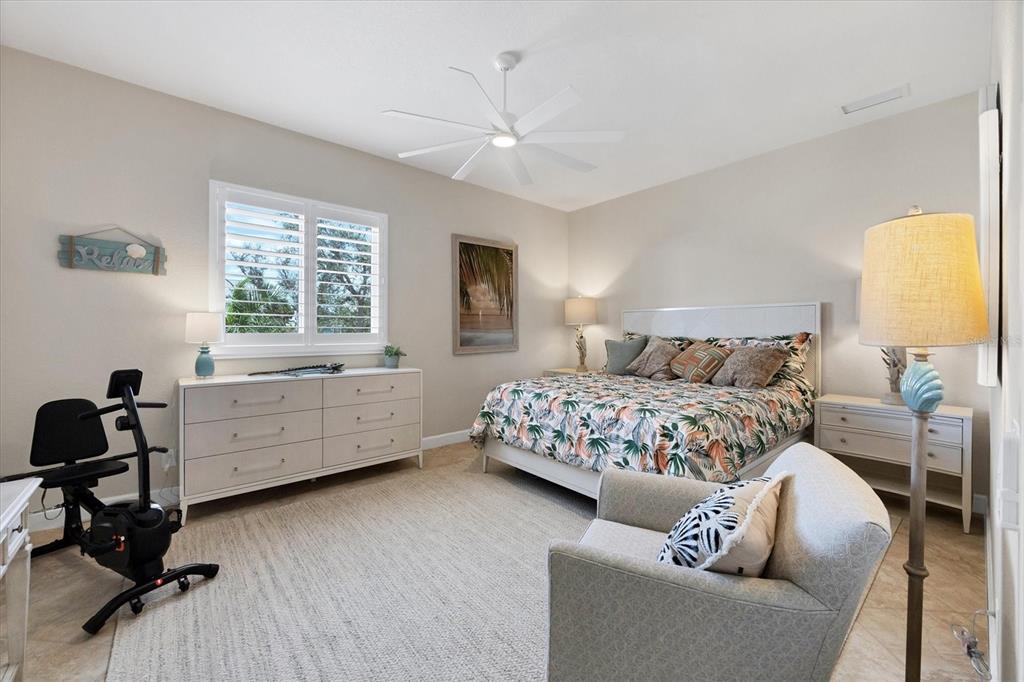 4111 North Beach Road Englewood, FL 34223 - Photo 42 of 87 a bedroom with a bed and a window