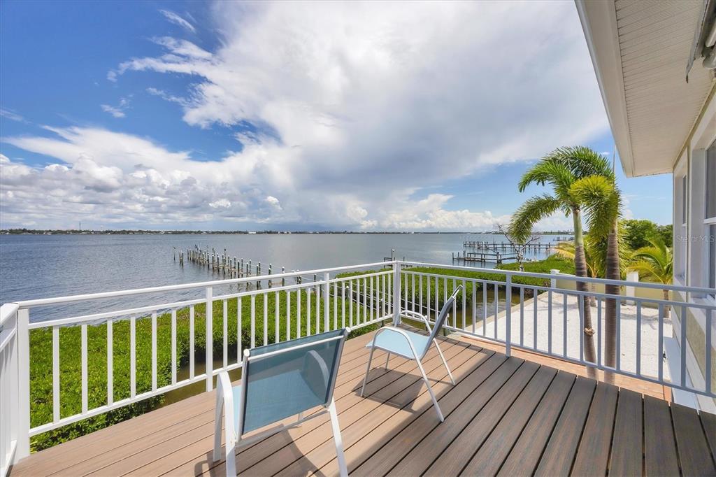 4111 North Beach Road Englewood, FL 34223 - Photo 46 of 87 a view of balcony with wooden floor and fence