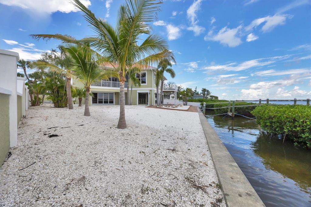 4111 North Beach Road Englewood, FL 34223 - Photo 54 of 87 a view of a yard with sitting area