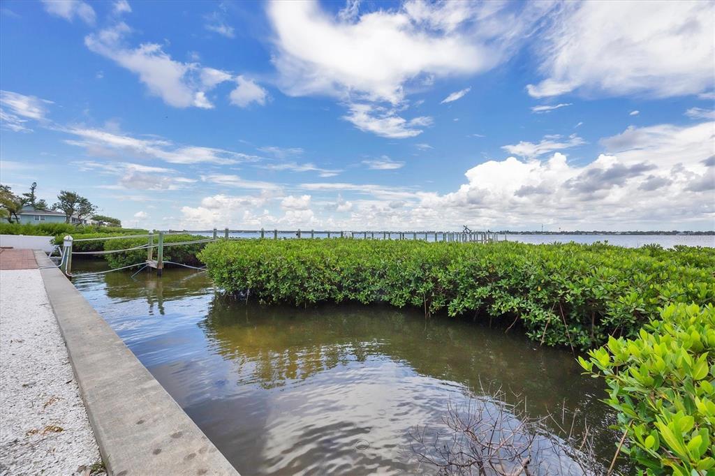 4111 North Beach Road Englewood, FL 34223 - Photo 61 of 87 a view of a lake with houses in the back