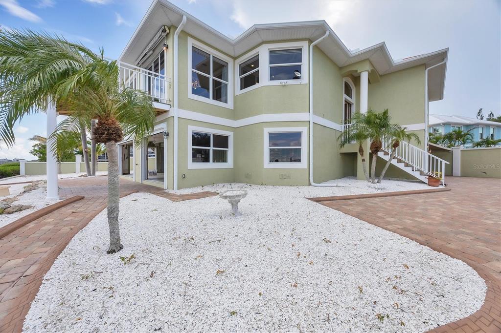 4111 North Beach Road Englewood, FL 34223 - Photo 7 of 87 a view of a house with a swimming pool