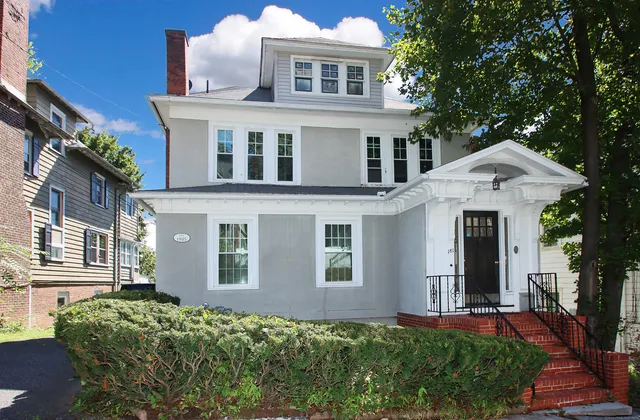 front view of a house with a yard