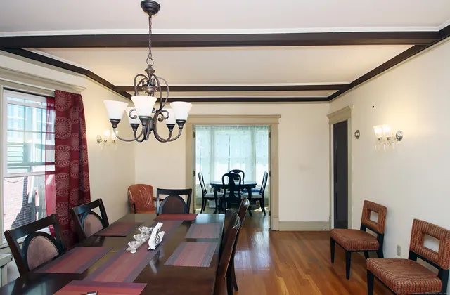 a view of a livingroom with furniture window and wooden floor