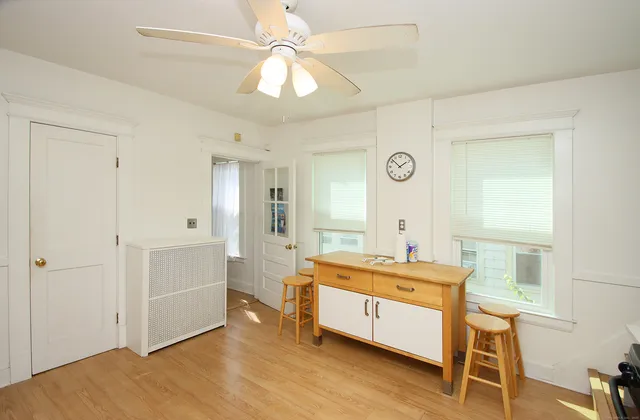 a room with a bed and a table in it