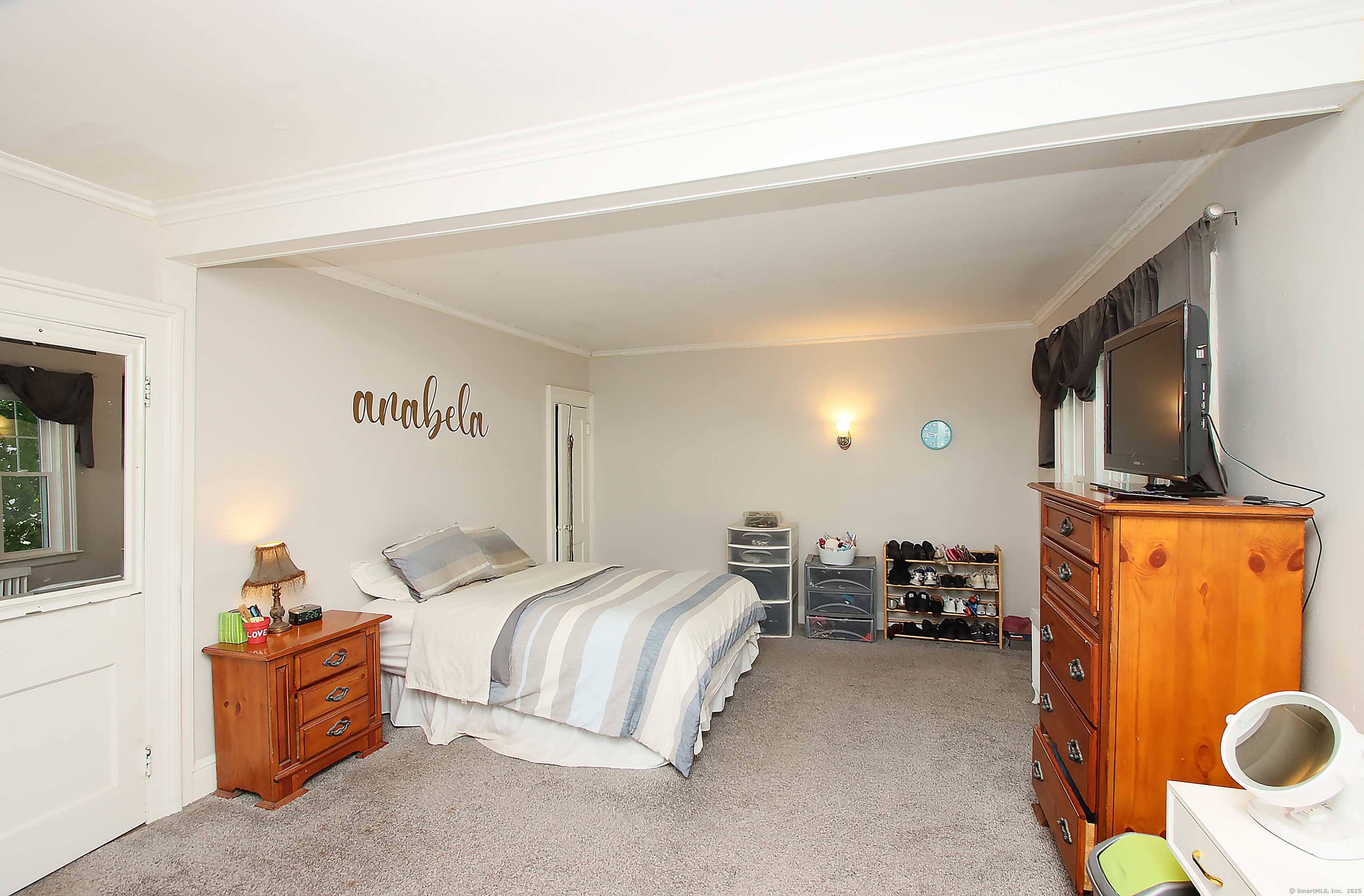 181 Buckingham Street Waterbury, CT 06710 - Photo 19 of 40 a bedroom with bed and window