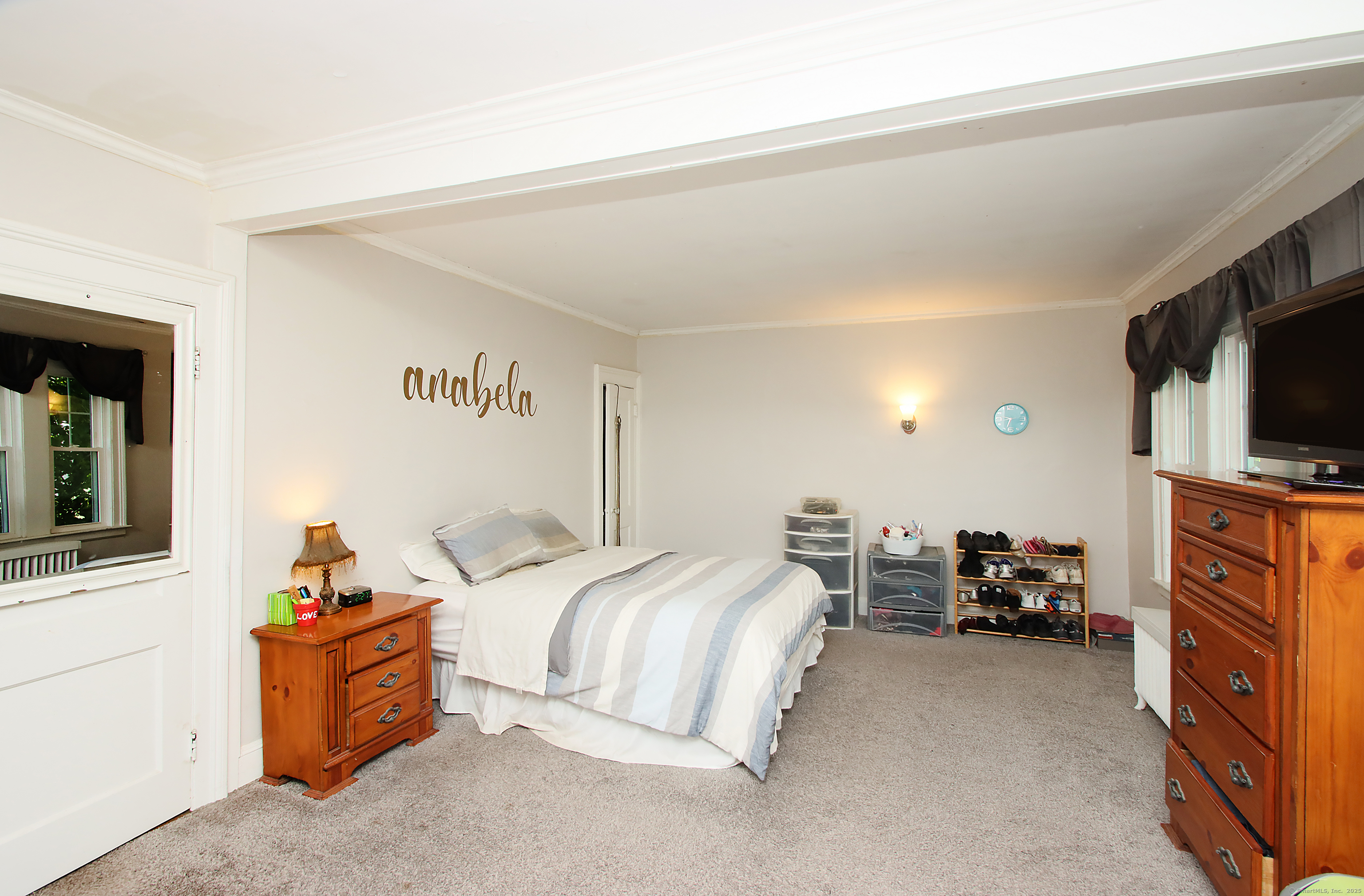 181 Buckingham Street Waterbury, CT 06710 - Photo 21 of 40 a bed room with a bed and a television