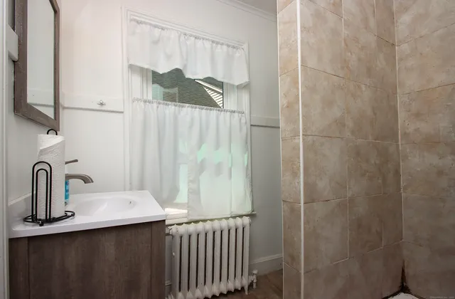 a bathroom with a sink and a mirror