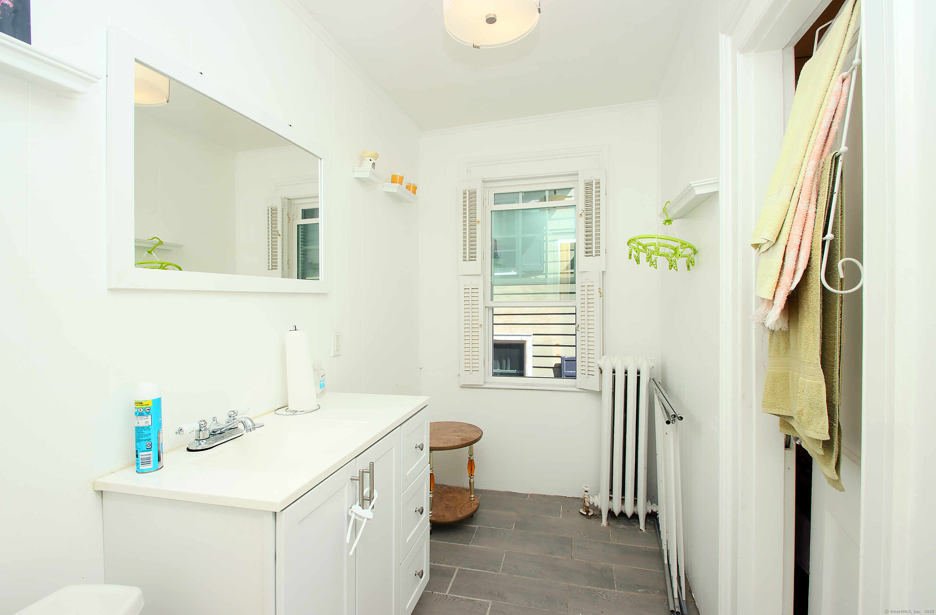 181 Buckingham Street Waterbury, CT 06710 - Photo 25 of 40 a bathroom with a sink a toilet and shower