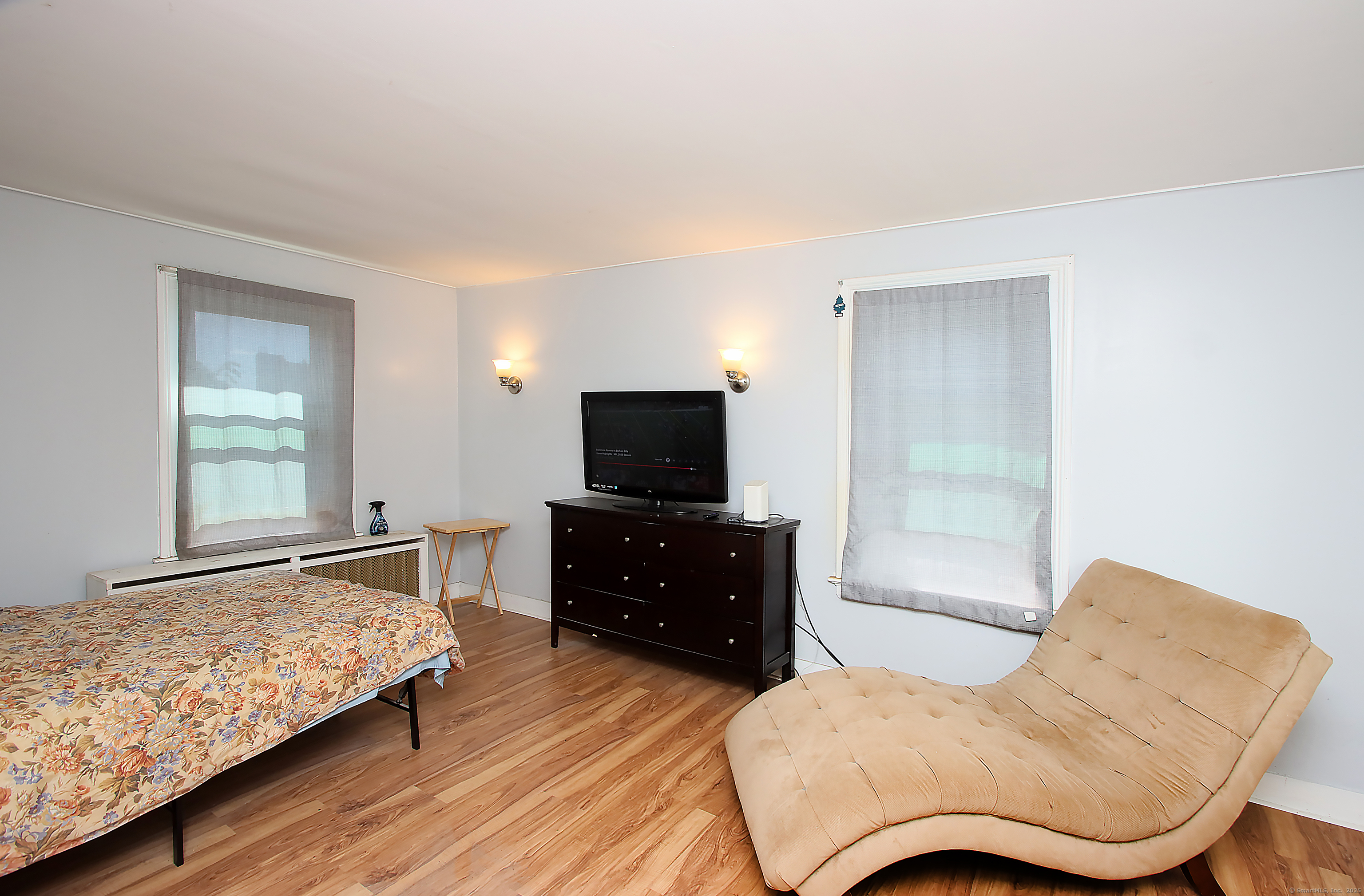 181 Buckingham Street Waterbury, CT 06710 - Photo 29 of 40 a living room with furniture and a flat screen tv