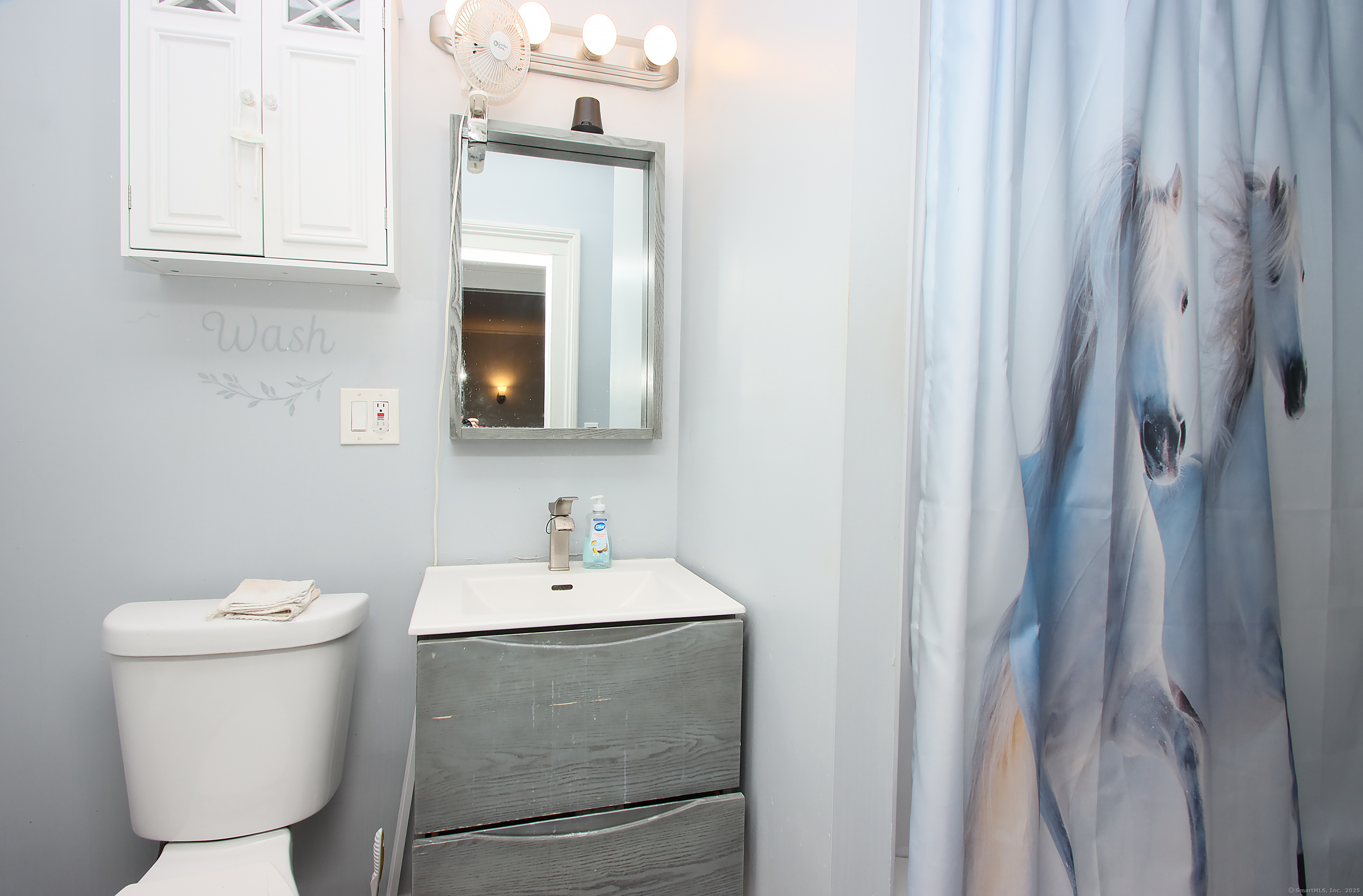 181 Buckingham Street Waterbury, CT 06710 - Photo 31 of 40 a bathroom with a sink toilet and vanity