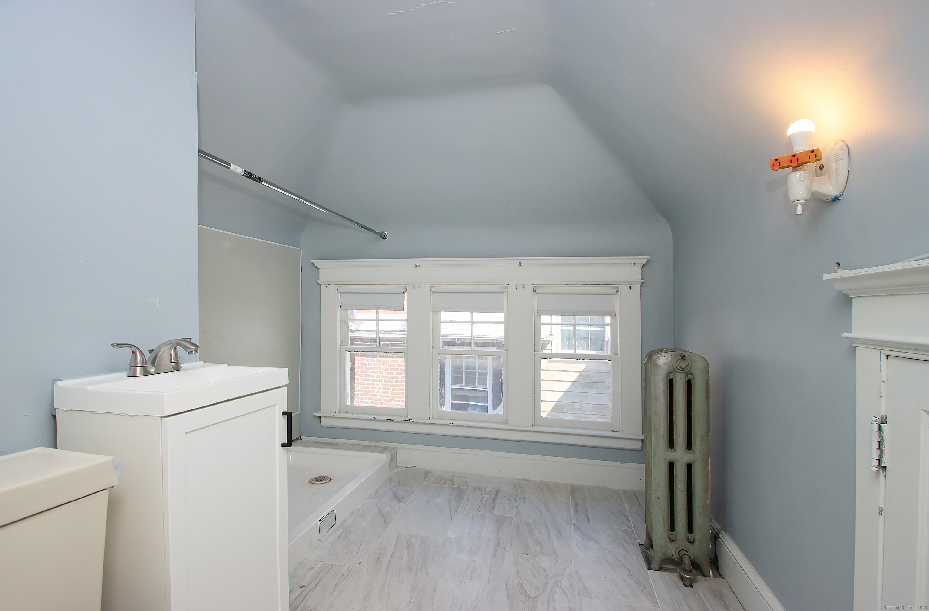 181 Buckingham Street Waterbury, CT 06710 - Photo 34 of 40 a bathroom with a sink a toilet and a tub