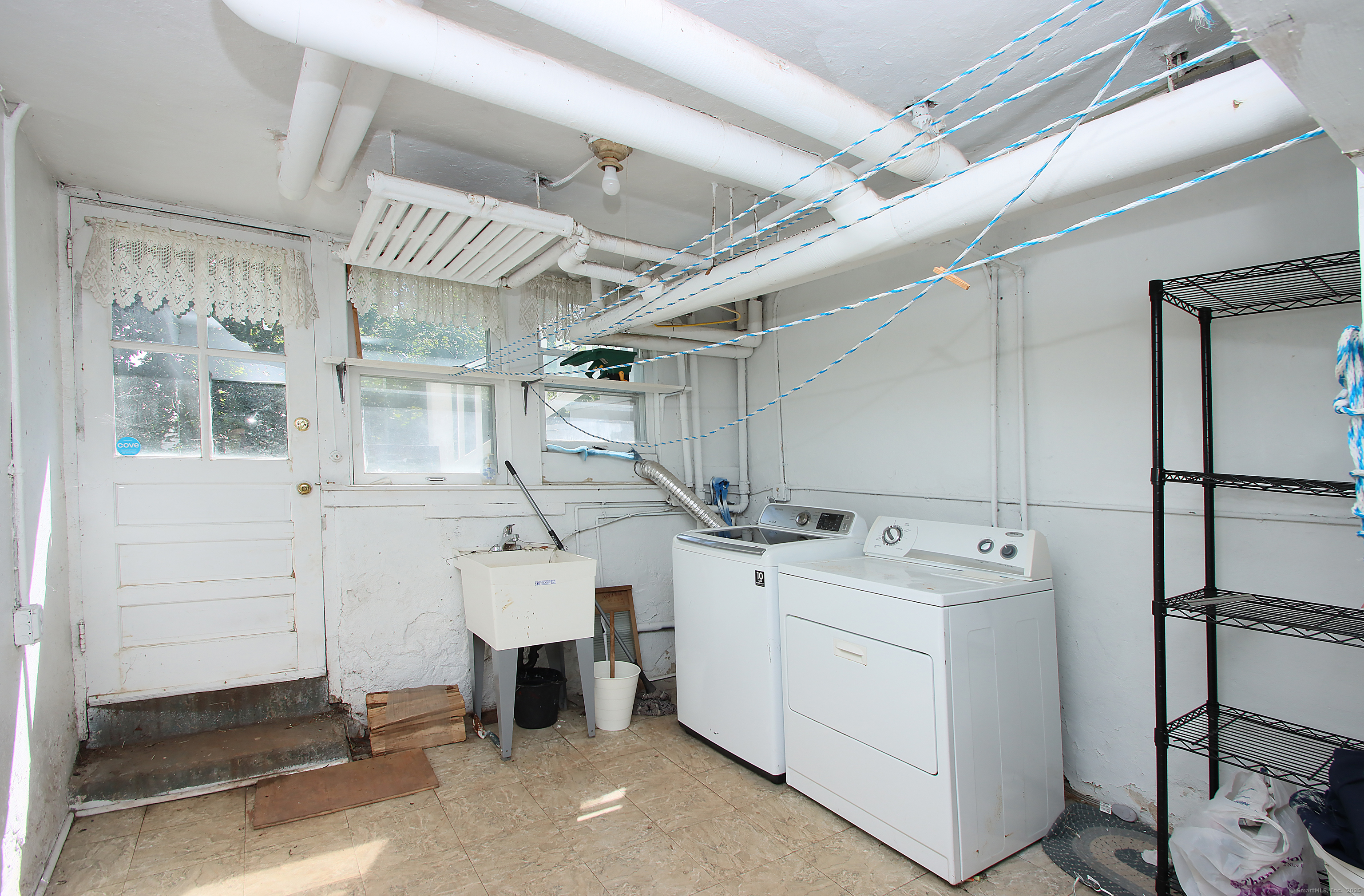 181 Buckingham Street Waterbury, CT 06710 - Photo 35 of 40 a utility room with dryer and washer