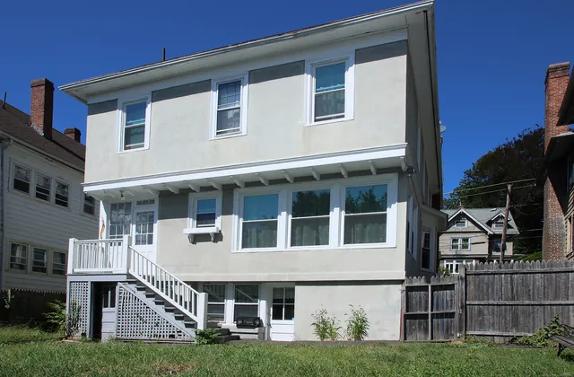 a view of backyard with green space