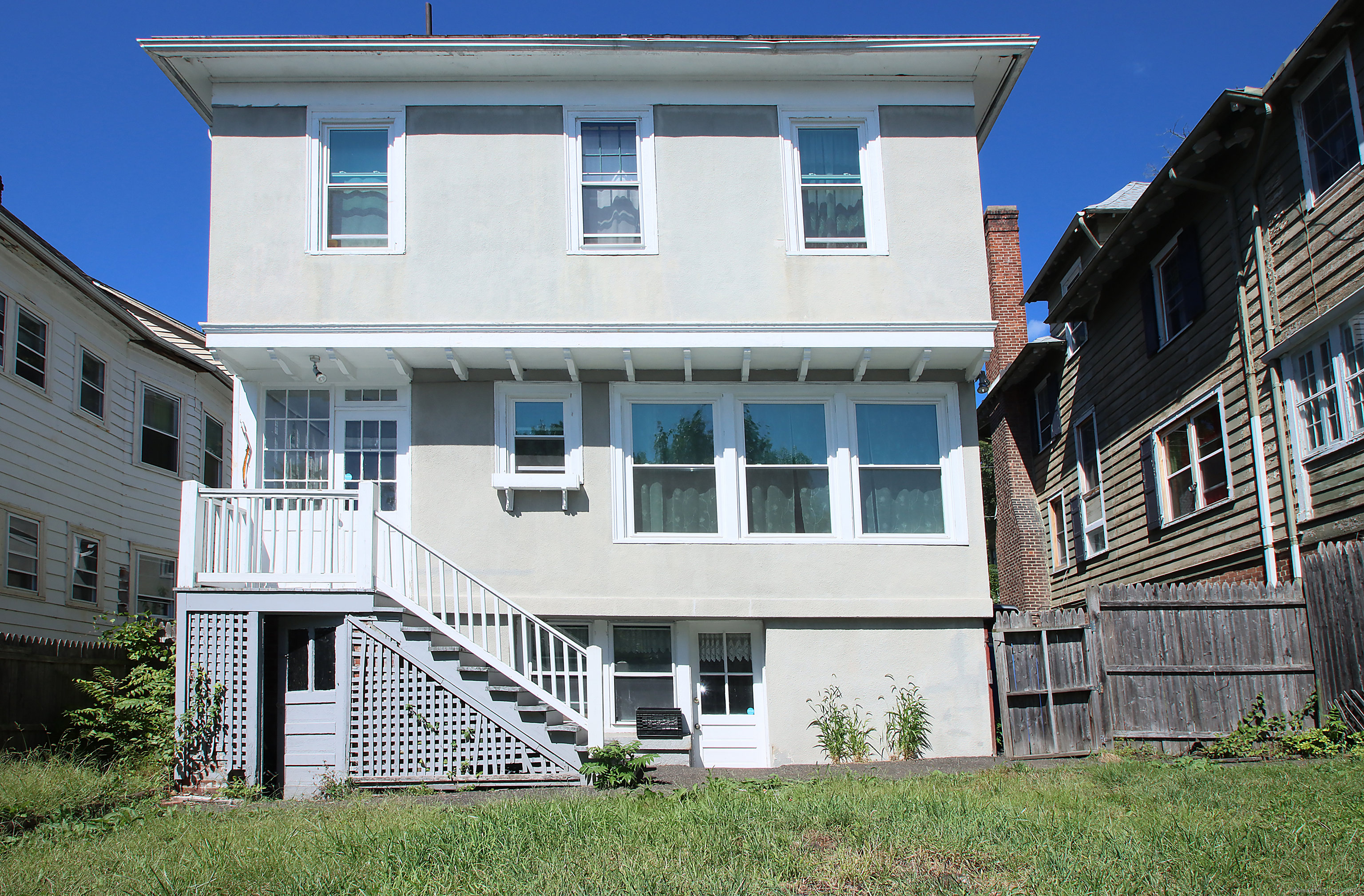 181 Buckingham Street Waterbury, CT 06710 - Photo 38 of 40 a front view of a house with a yard