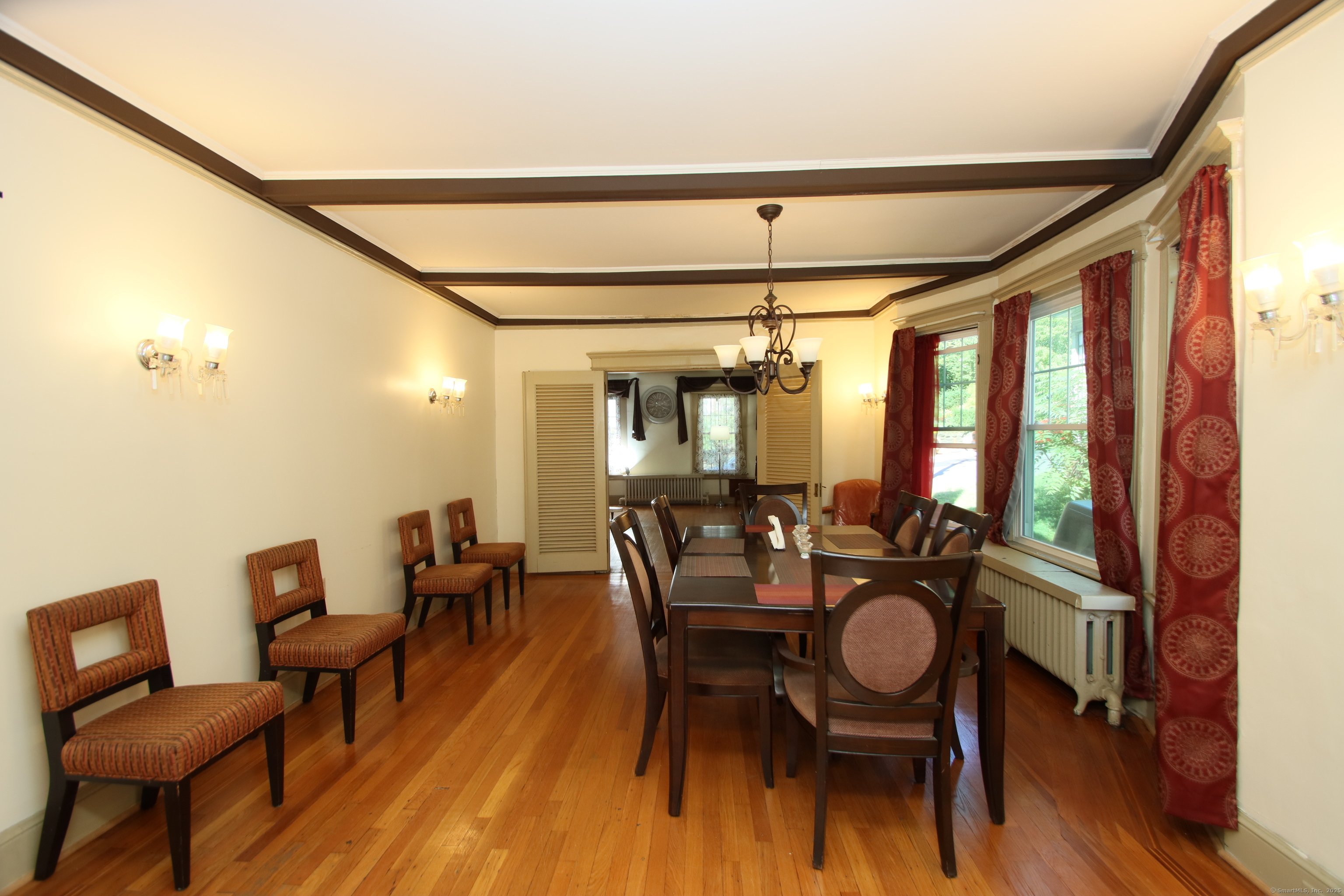 181 Buckingham Street Waterbury, CT 06710 - Photo 9 of 40 a view of a dining room with furniture window and wooden floor