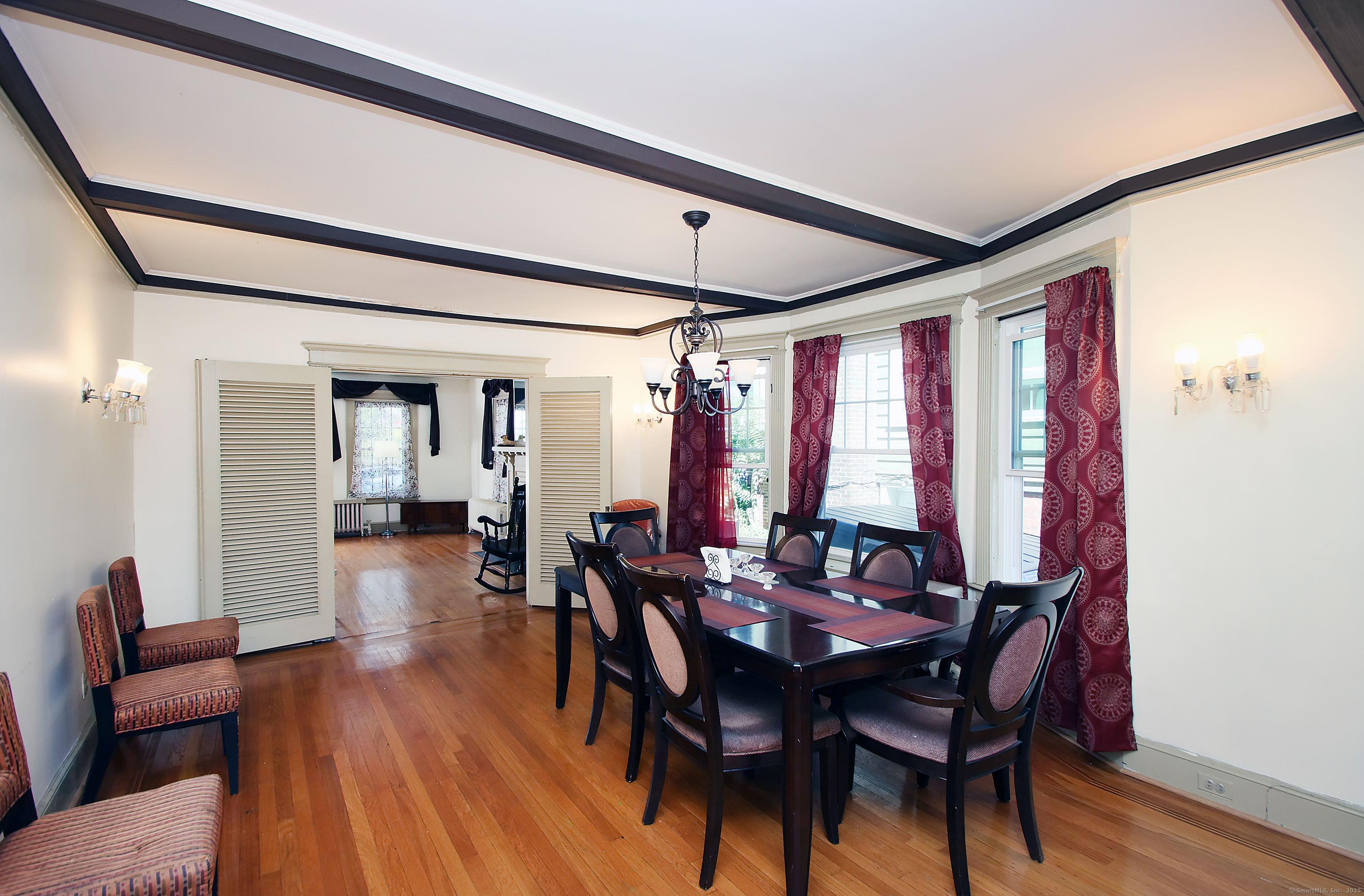 181 Buckingham Street Waterbury, CT 06710 - Photo 10 of 40 a view of a dining room with furniture window and wooden floor