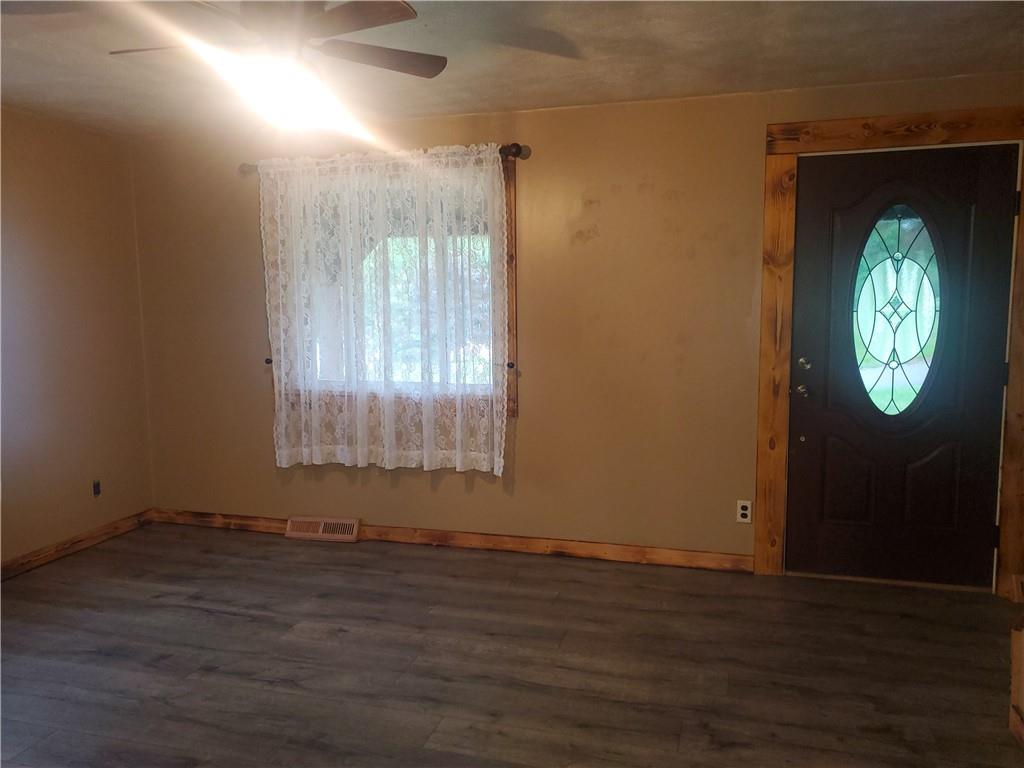132 Laird's Crossing Road Worthington, PA 16262 - Photo 9 of 20 an empty room with wooden floor and windows