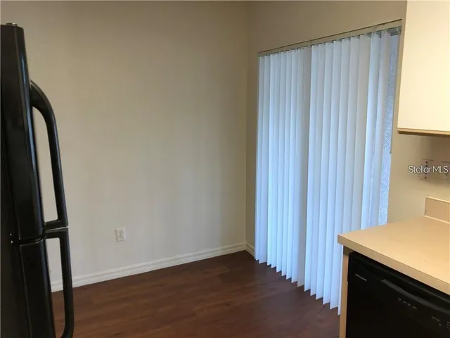 an empty room with wooden floor