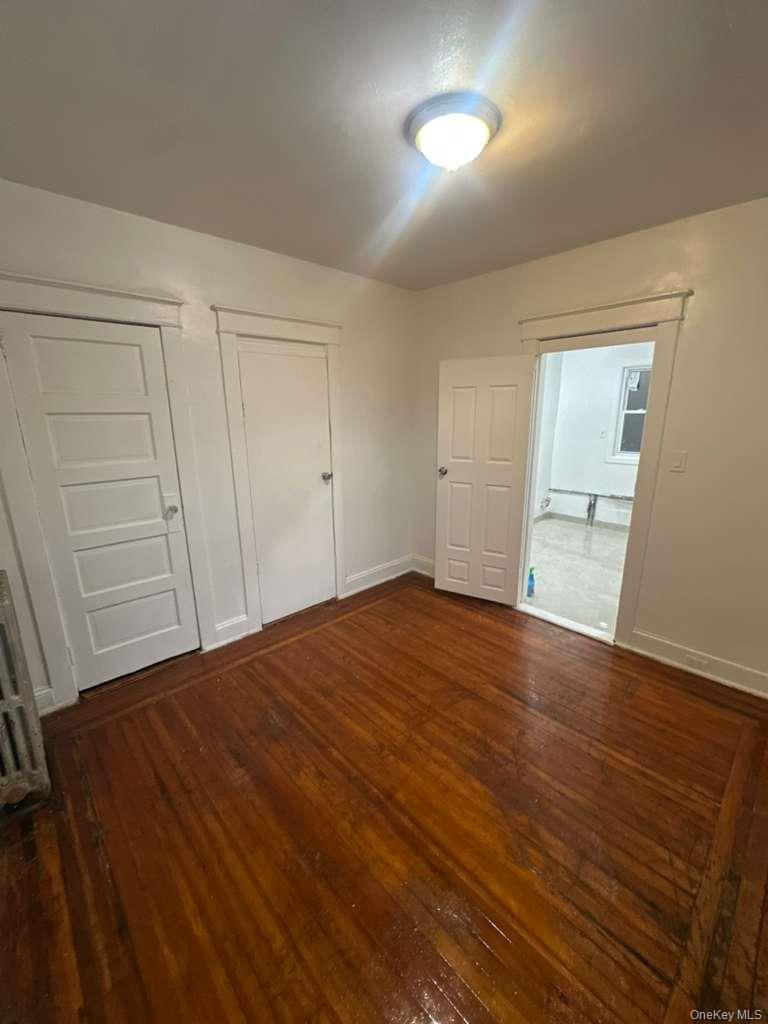 3581 Eastchester Road, Unit 2 Bronx, NY 10469 - Photo 5 of 13 a view of empty room with wooden floor